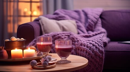  a coffee table with two glasses of wine and a tray of food on top of it next to a couch.  