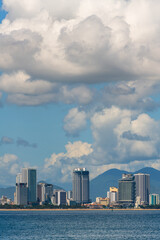 Wall Mural - View of the sea bay and the Vietnamese city of Nha Trang on a sunny cloudy day