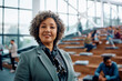 © Drazen - Female business leader during education training at convention center looking at camera.