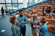 © Drazen - Group of entrepreneurs talking on break while attending business seminar in conference hall.
