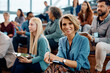 © Drazen - Happy female entrepreneur attending business conference in convention center and looking at camera.