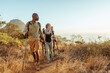 © Marko Geber - Group of young hikers looking at sunset on mountain