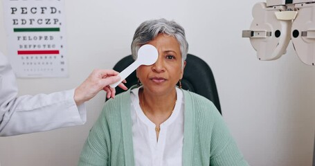 Wall Mural - Eye care, reading test and woman in office with occluder, doctor and health insurance in clinic. Advice, eyesight consultation and mature patient in exam to check eyes for glasses, lens and vision.