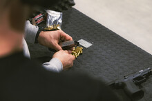 loading ammunition into weapons at 
shooting range