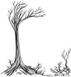 kahler Baum mit Büschen und Gräsern umgeben