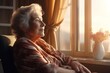 older woman looking out the window spending time alone at home