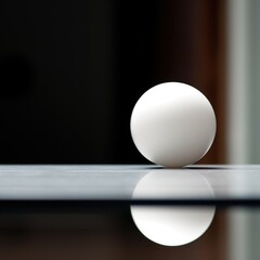 Poster - A white ball sitting on a table with a reflection, AI