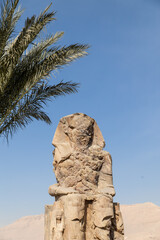 Wall Mural - Massive ruined stone Pharaoh statues at Colossi of Memnon in Luxor, Egypt