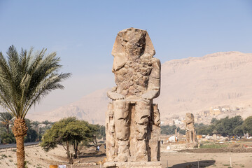 Wall Mural - Massive ruined stone Pharaoh statues at Colossi of Memnon in Luxor, Egypt