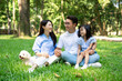 © Timeimage - Photo of young Asian family at park