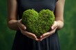 Nurturing love. Human hands cradle young green tree heart. Eco affection. Growing love for nature and sustainable living. Sustainable romance. Holding life beginnings