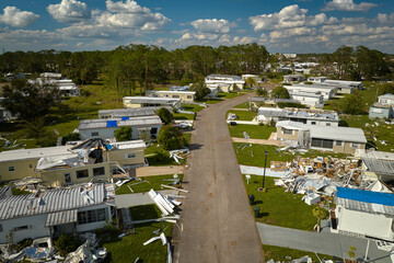 Wall Mural - Badly damaged mobile homes after hurricane Ian in Florida residential area. Consequences of natural disaster