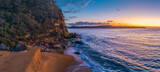 Fototapeta  - Aerial sunrise panorama over the headland, ocean, rocks and beach