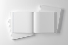 Opened square hardcover book mockup. 3D rendering