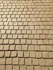 Wall Mural - Paving stones on the road as an abstract background. Texture