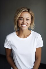 Wall Mural - portrait of a smiling woman wearing a blank white t-shirt - studio closeup mockup template