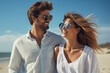 © JoyImage - Couple in sunglasses walking along on the beach in summer. Created with Generative AI technology