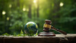 International Environmental law concept. World and gavel with scales of justice and hammer on a green forrest background, global economic regulation.