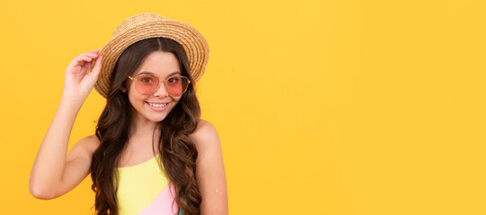 Canvas Print - cheerful teen girl with curly hair on yellow background. happy childrens day. Child face, horizontal poster, teenager girl isolated portrait, banner with copy space.