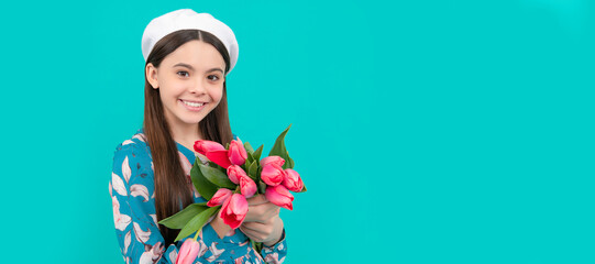 Poster - glad child in beret with tulips. mothers or womens day. kid hold flowers for 8 of march. Banner of spring child girl with tulips flowers bouquet, studio portrait with copy space.