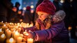 A Lutheran child lights candles during the Winter Lights Festival in Reykjavik, an annual celebration in February to celebrate the coming of Spring after a long, dark winter.
