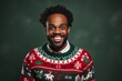 African American man laughing in ugly Christmas sweater