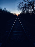 Fototapeta Niebo - Tory o zachodzie słońca