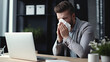 © l1gend - Young man hand blowing nose, sneezing in tissue at the office