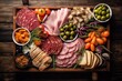 Snacks for wine,natural delicious deli meats with vegetables and olives on wooden ,Healthy food.