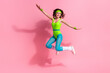 Photo of carefree sportive trainer lady jumping high practice cardio routine isolated on pastel color background