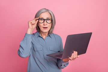 Sticker - Photo of shocked senior lady wear stylish clothes hand hold modern device touch eyewear isolated on pink color background