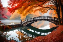 Scenic View Of Misty Autumn Landscape With Beautiful Old Bridge With Swan On Pond In The Garden With Red Maple Foliage.
