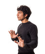 A man in a black sweater is making a hand gesture as saying: wait, stop there, caution, wait a moment, slow down