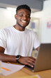 © Andrii Zastrozhnov - Confident African American businessman working on a laptop from home, embodying a modern and successful professional lifestyle.