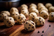Chocolate chip cookie dough. Balls of vanilla shortbread dough with chocolate chips. Cooking, cookie recipe, quick baking. 