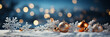 christmas balls on a snowy ground with snowfall bokeh in the background