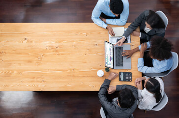 Wall Mural - Panorama top view multiracial analyst team use BI dashboard display on laptop screen, analyzing financial data for strategic decision. Fintech analyzes marketing indicators. Concord