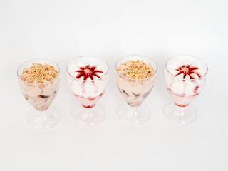 Wall Mural - Ice cream on a white background. Ice cream in a plastic cup on a white background.
