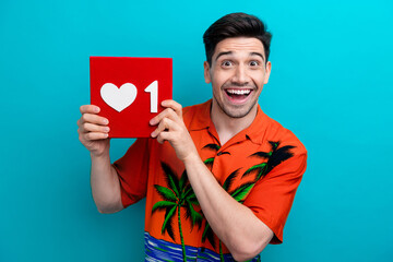 Sticker - Portrait of impressed ecstatic guy wear tropical shirt hold social media like in arms astonished staring isolated on blue color background