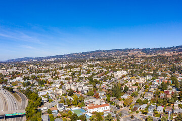 Wall Mural - Aerial images over the hills of Oakland, California with a community of apartments on a beautiful summer day