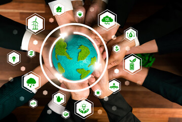 Wall Mural - Business partnership holding Earth globe together with eco design icon symbolize ESG sustainable environment protection with eco technology and carbon credit solution for net zero ecosystem. Reliance