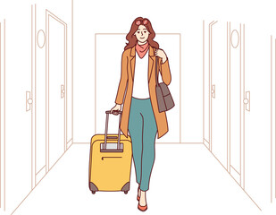 Wall Mural - Woman tourist is in corridor of hotel, goes with travel suitcase, after completing business trip