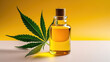 Glass bottle of hemp oil with green cannabis leaves. Mockup container of oil for cosmetic, medicinal and culinary purposes. 