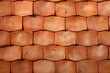 Shingled, oblong terracotta roof tiles, close up exterior surface material texture