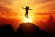 © DailyStock - Silhouette of a Man Jumping at Sunset or Sunrise Over a Cliff from Mountain Top. New Year, Success, Goal, Finance, Freedom, Happiness, Achievement. Copy Space for Text, Ideal for Banner or Poster.