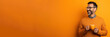 © AI_images - Happy man with cup of coffee on orange background