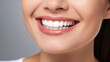© Farid - oung beautiful woman smiling on white background. Oral hygiene concept close up. Made with generative ai