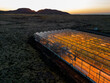 Aerial view of a greenhouse and the vulcanic Landscape near Grindavik, iceland at sunrise
