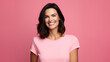 © Ai Studio - Radiant brunette in pink tee beams with vivacity, showcasing a captivating smile against a rosy backdrop