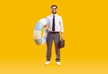 Happy Businessman Combines Business Trip And Summer Holiday. Full Body Length Adult Man In Office Wear With Water Floatie And Briefcase Standing Isolated On Yellow Background. Vacation, Travel Concept